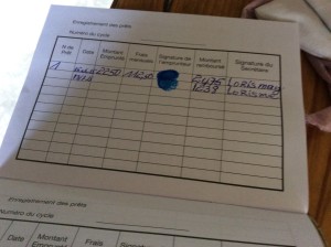 A record of Atelia's loan and her first repayment in a separate section of her savings booklet.